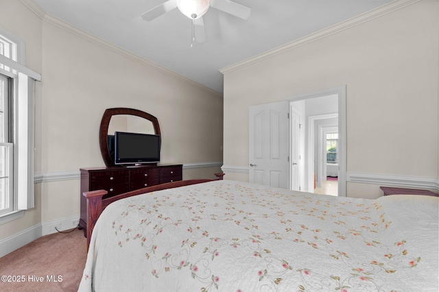 bedroom with ceiling fan, carpet flooring, baseboards, and ornamental molding