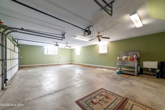 garage with baseboards and a garage door opener