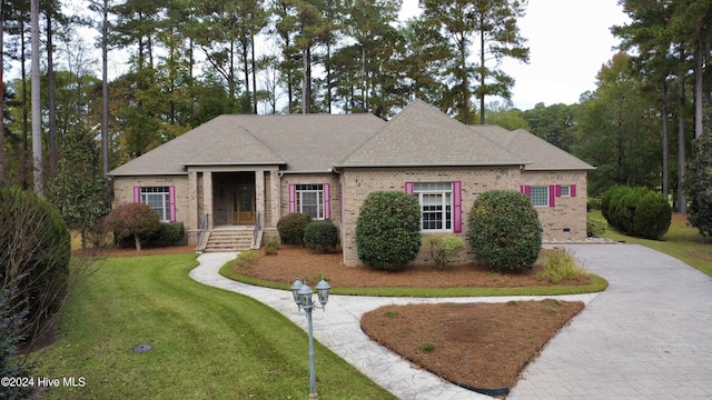 view of front of home with a front yard