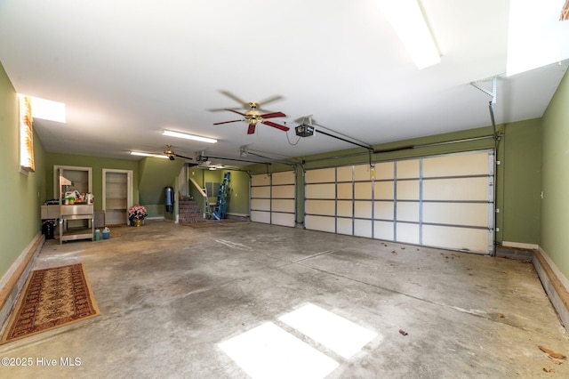 garage featuring baseboards and a garage door opener