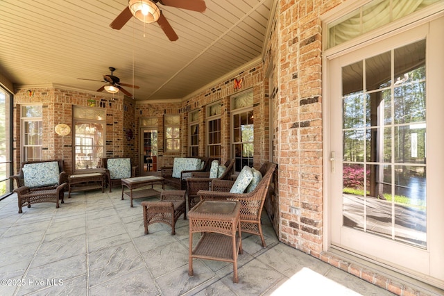 view of patio with an outdoor living space and a ceiling fan