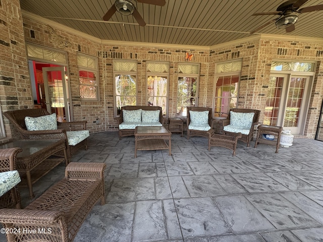 view of patio / terrace with ceiling fan and an outdoor living space
