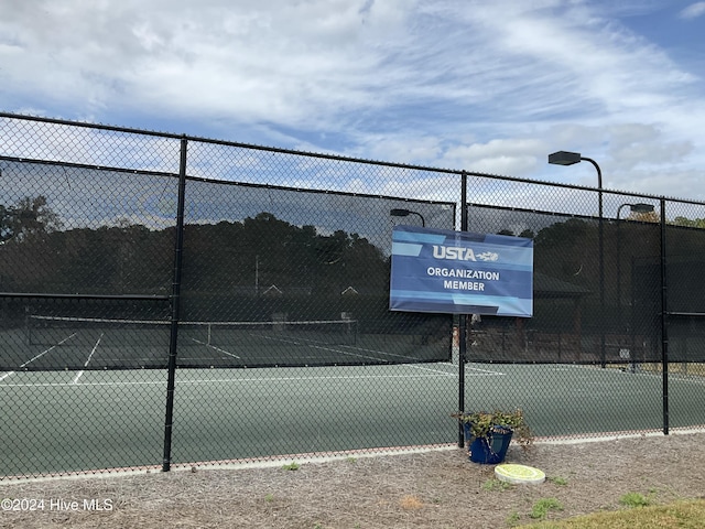 view of sport court with fence