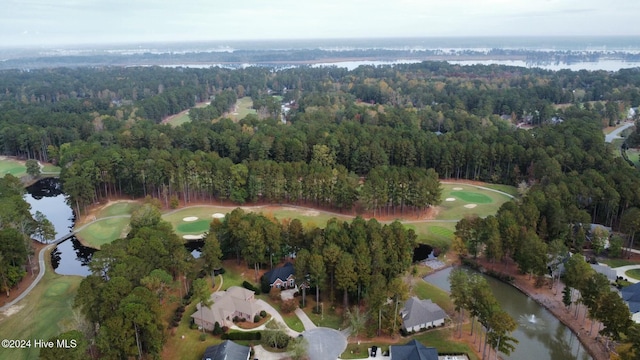 bird's eye view featuring golf course view, a water view, and a view of trees