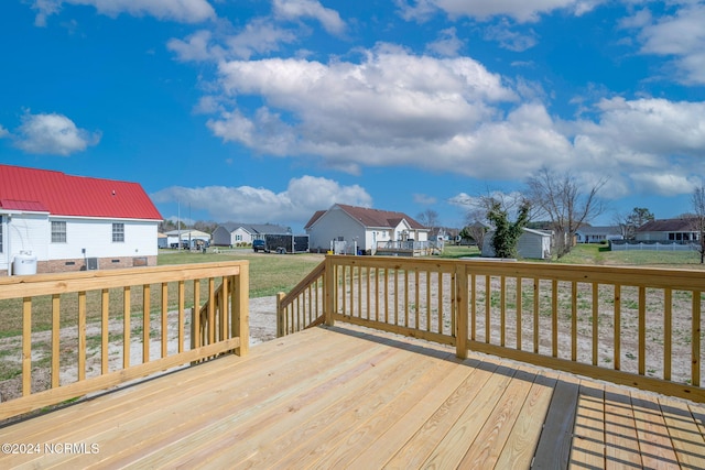 wooden deck featuring a yard