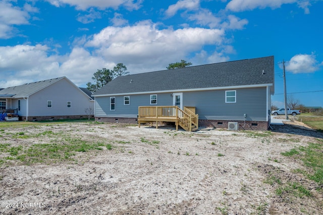 back of property with a deck