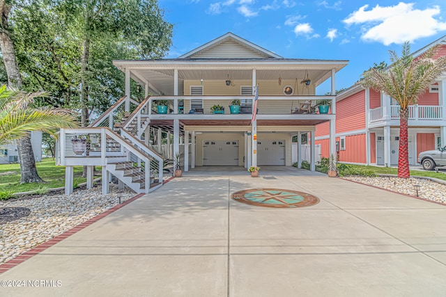 view of front of house with a garage and a carport