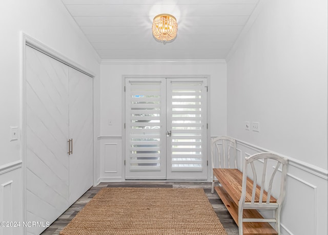 foyer entrance featuring french doors, crown molding, and wood-type flooring