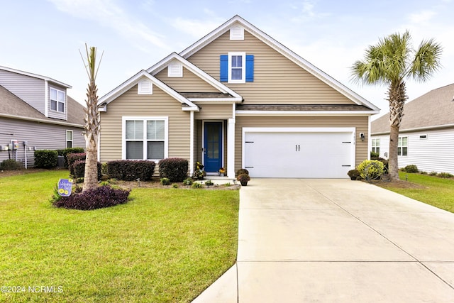 view of front of house featuring a front lawn and a garage