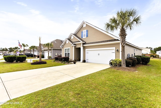 view of front of house featuring an attached garage, concrete driveway, and a front lawn