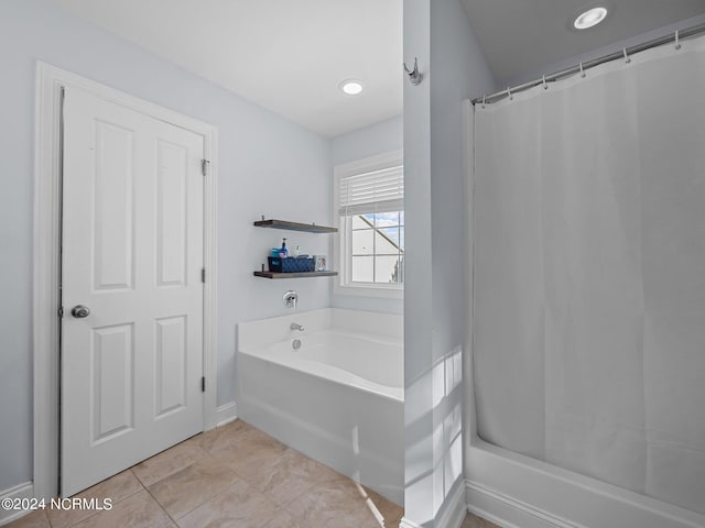 bathroom featuring tile patterned floors and a bathtub