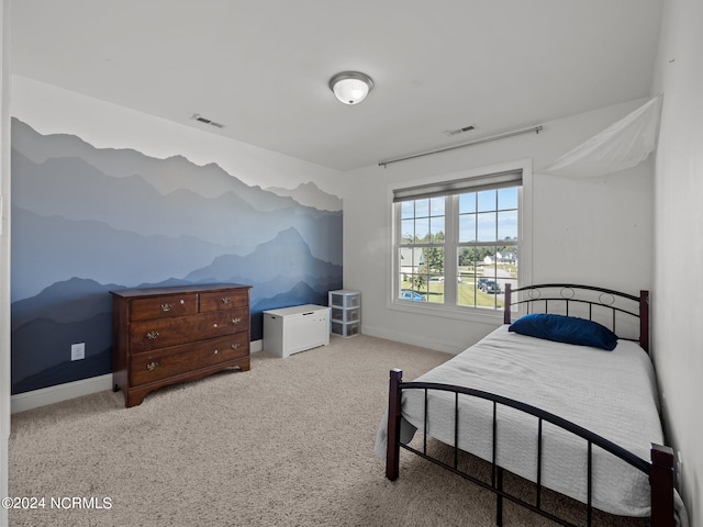 bedroom featuring light colored carpet