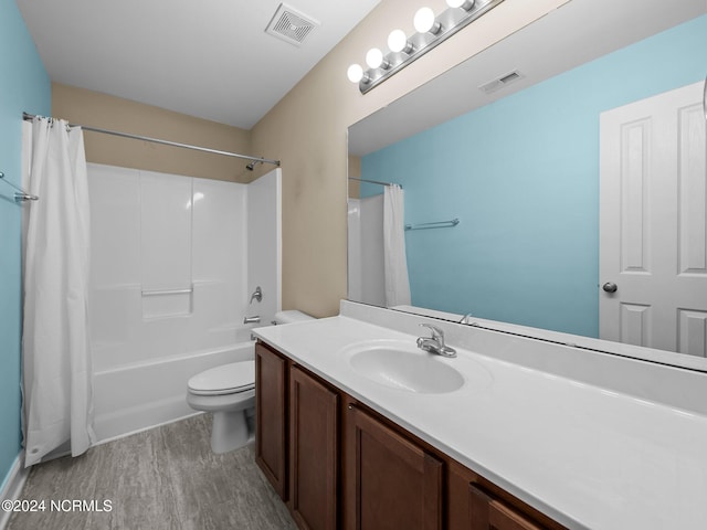 full bathroom featuring wood-type flooring, vanity, toilet, and shower / bath combo