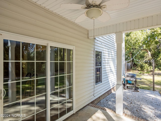 exterior space with ceiling fan and a patio area