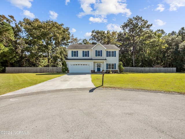 front of property featuring a garage and a front lawn