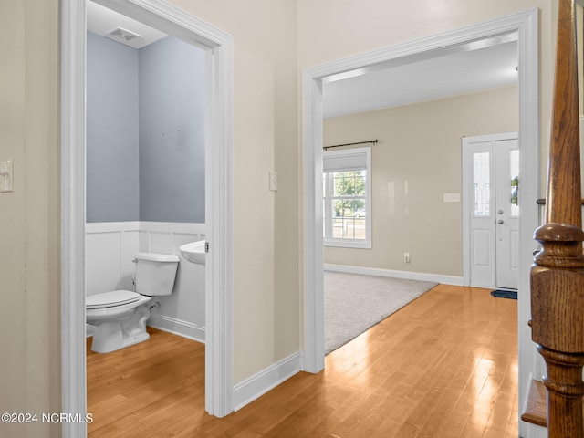 interior space featuring toilet and hardwood / wood-style flooring