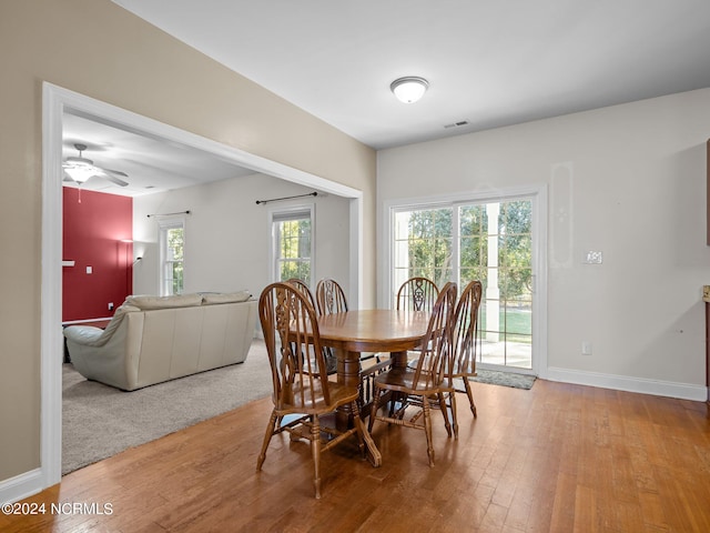 dining space featuring hardwood / wood-style floors and ceiling fan