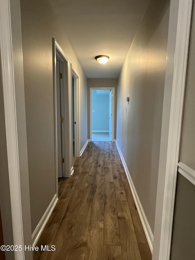 hallway featuring dark hardwood / wood-style floors