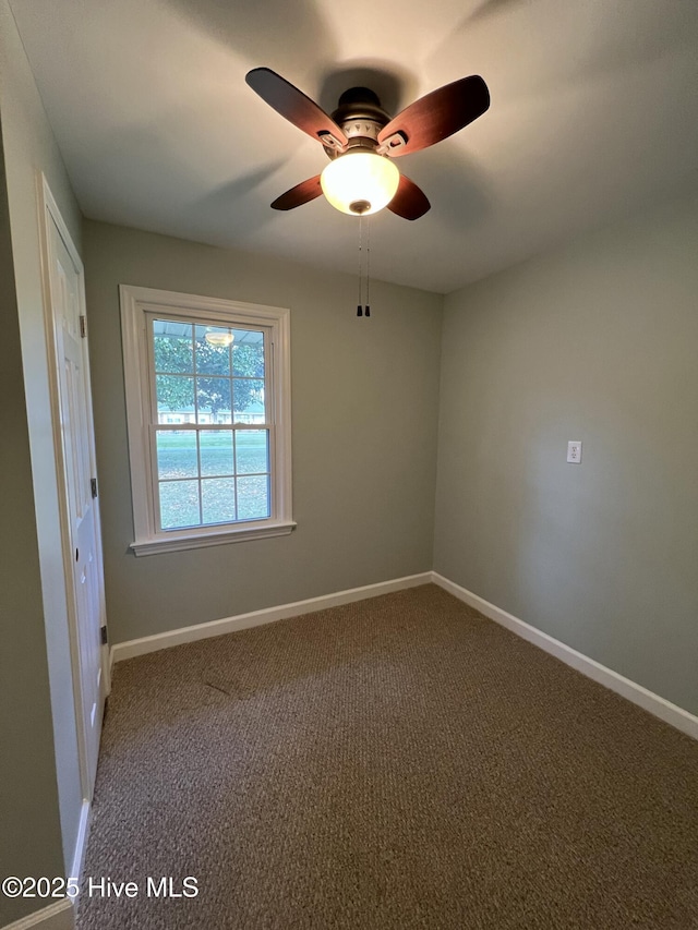 unfurnished room featuring carpet and ceiling fan