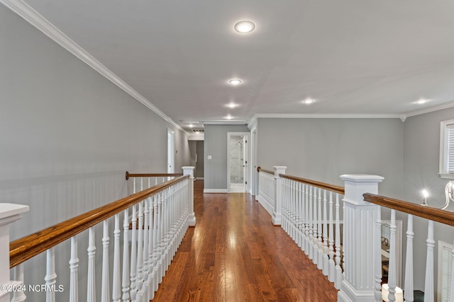 hallway featuring ornamental molding and dark hardwood / wood-style flooring