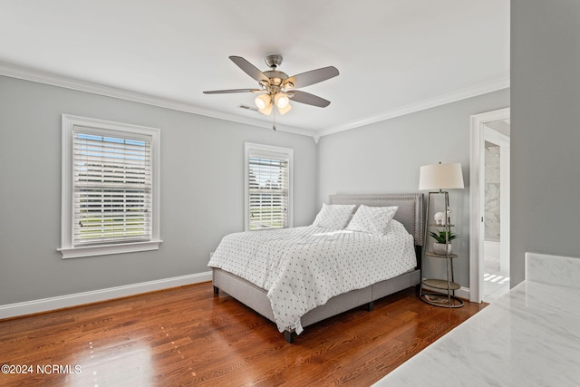 bedroom featuring wood-type flooring, ornamental molding, and ceiling fan