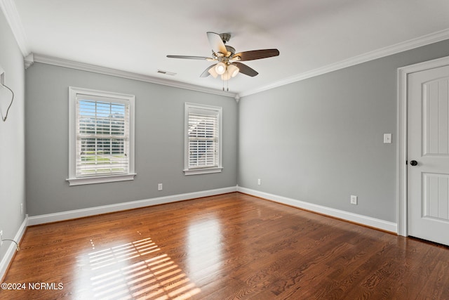 spare room featuring ceiling fan, ornamental molding, and wood-type flooring