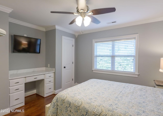 bedroom with dark hardwood / wood-style flooring, crown molding, and ceiling fan