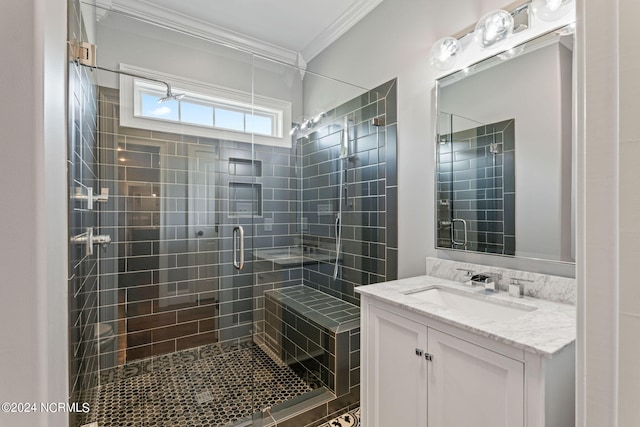 bathroom featuring vanity, crown molding, and a shower with door