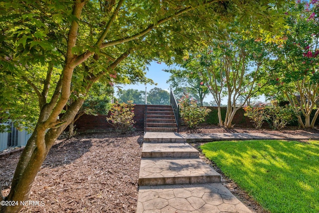 back of property with central AC, a lawn, a sunroom, and a patio