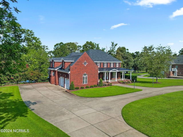 view of front of home featuring a front yard and a porch