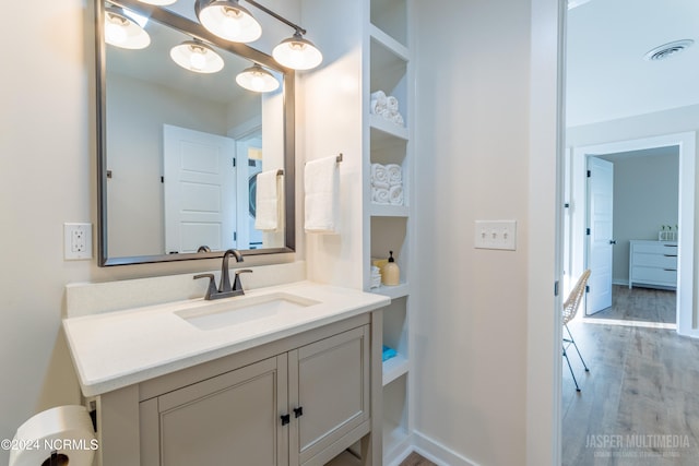 bathroom featuring vanity and hardwood / wood-style flooring