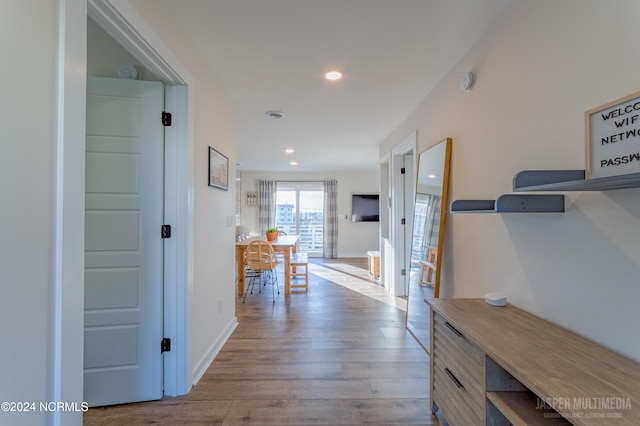 corridor featuring light hardwood / wood-style floors