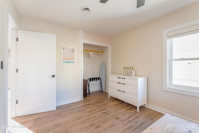 bedroom featuring a closet, ceiling fan, and light hardwood / wood-style flooring