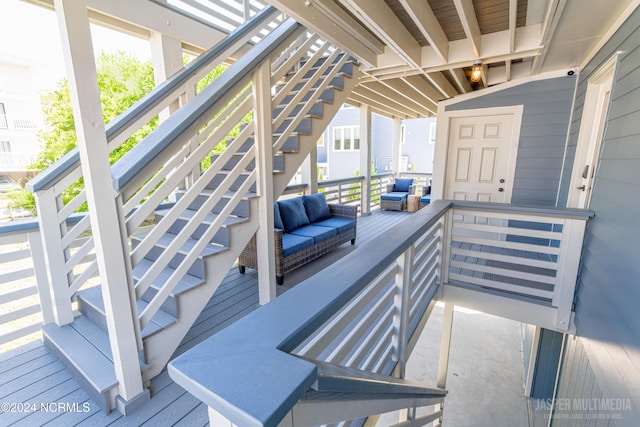 wooden deck featuring an outdoor living space