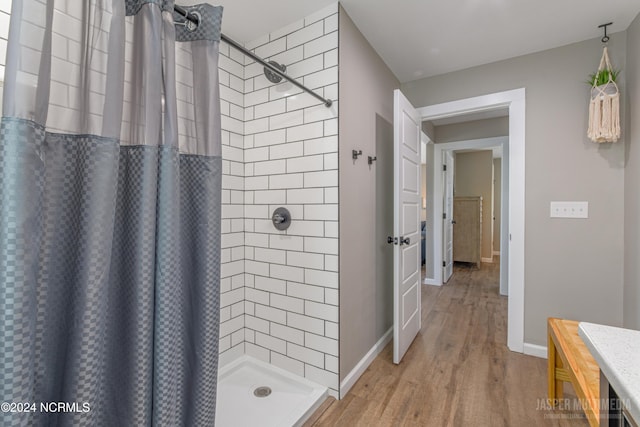 bathroom featuring a shower with curtain and wood-type flooring