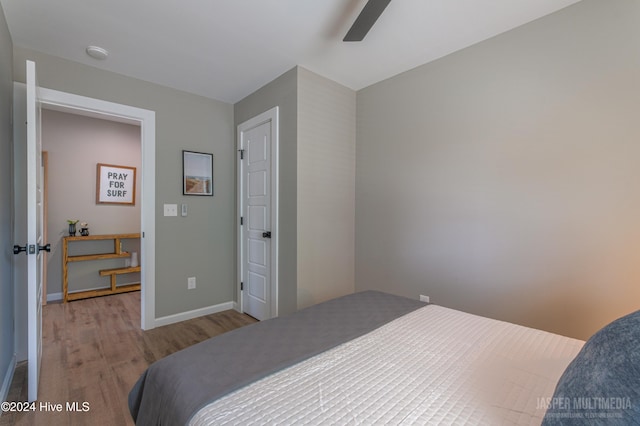 bedroom with light wood-type flooring and ceiling fan