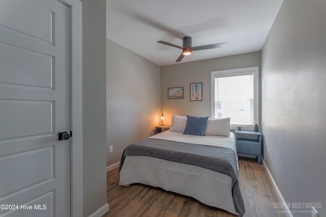 bedroom with hardwood / wood-style floors and ceiling fan