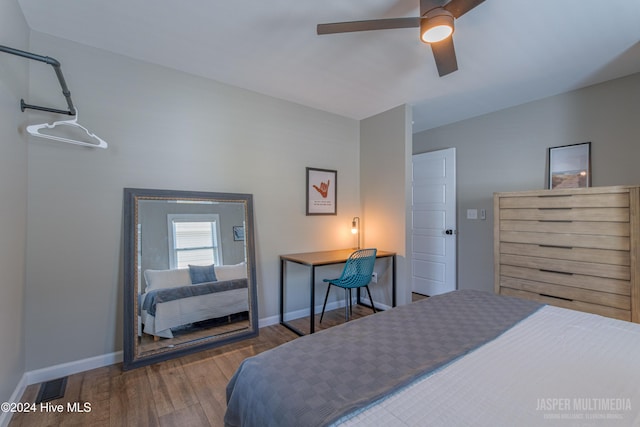 bedroom with hardwood / wood-style floors and ceiling fan