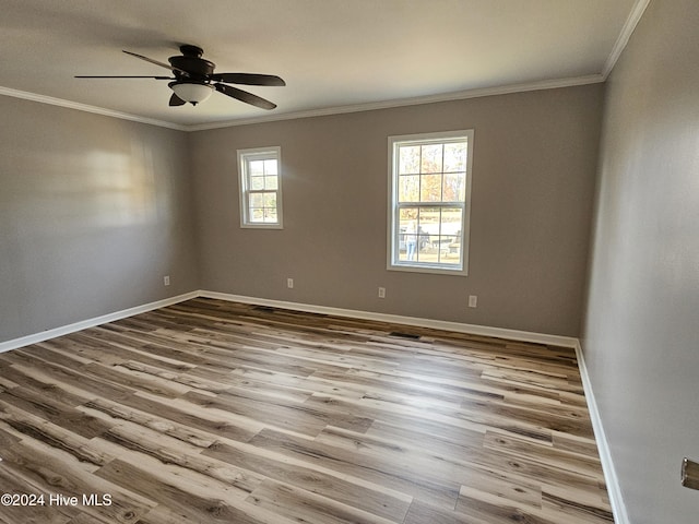 unfurnished room featuring ornamental molding, ceiling fan, and light wood-type flooring