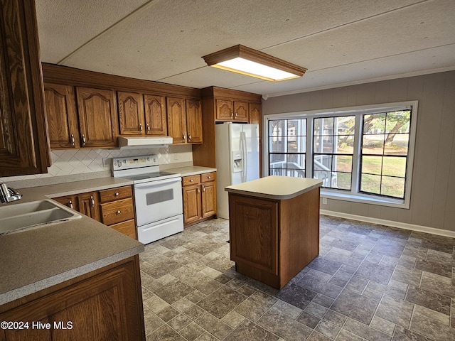 kitchen with crown molding, white appliances, sink, and a textured ceiling