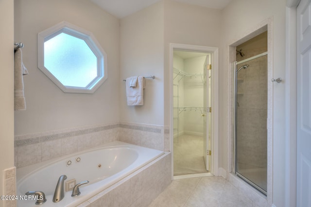 bathroom with tile patterned floors and separate shower and tub