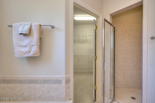 4315 Loblolly Cir SE, Southport, NC 28461 - bathroom featuring a shower stall and a spacious closet