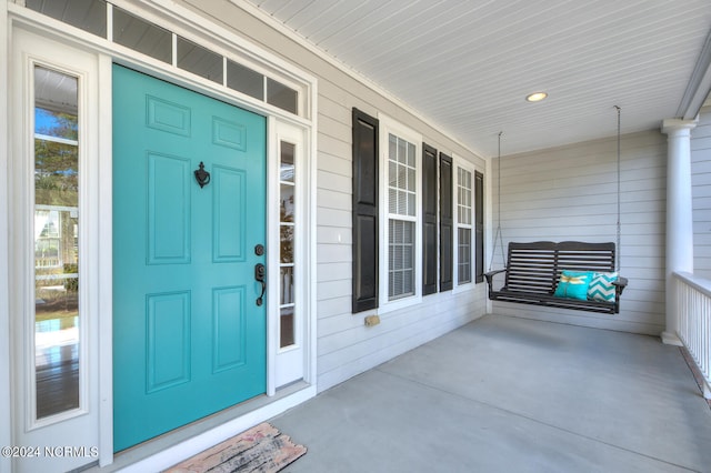 property entrance with covered porch