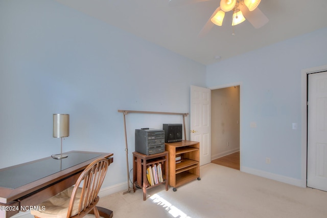 office area featuring light carpet and ceiling fan