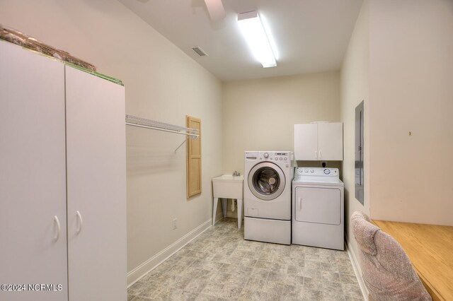 4315 Loblolly Cir SE, Southport, NC 28461 - washroom with washing machine and clothes dryer and cabinet space