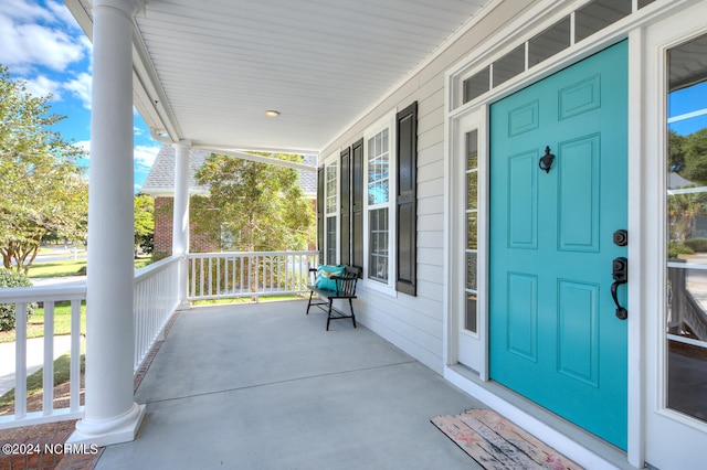 doorway to property with a porch