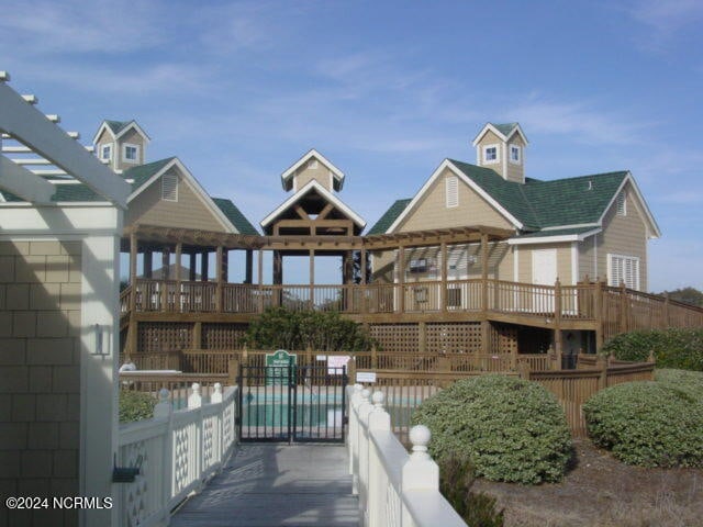 back of property with a wooden deck