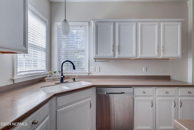 kitchen with white cabinetry, dishwasher, decorative light fixtures, and sink