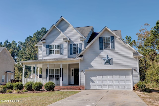 view of property featuring a garage and a porch