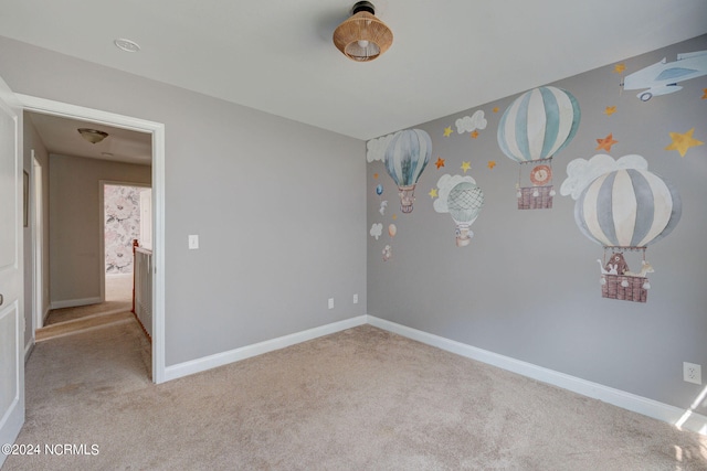 unfurnished bedroom with light carpet